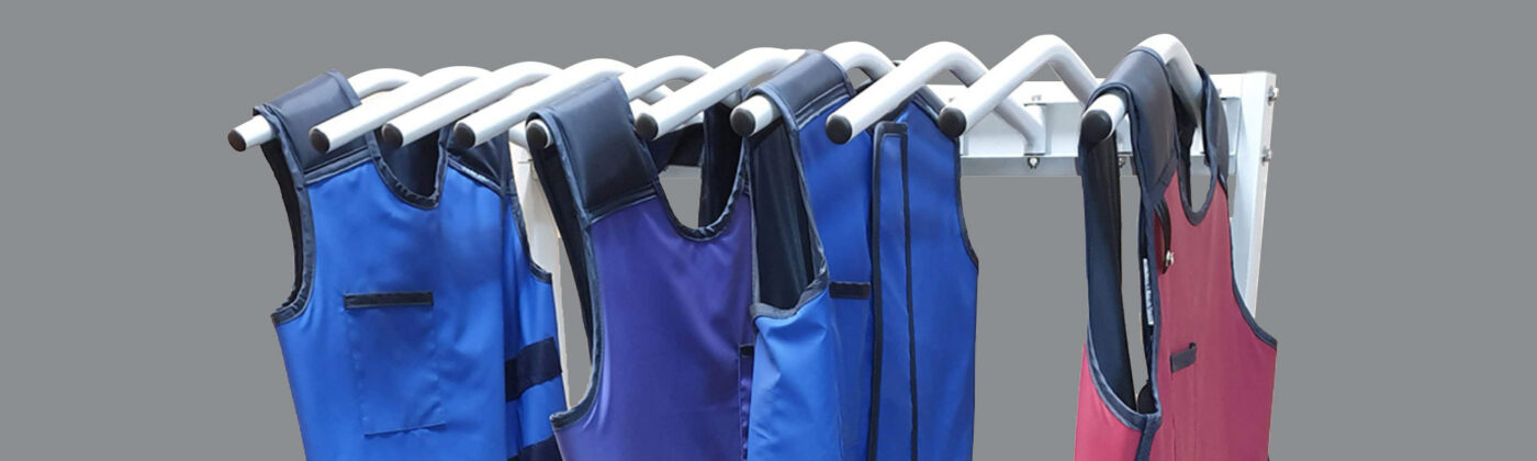 x-ray aprons hanging on the lead apron rack